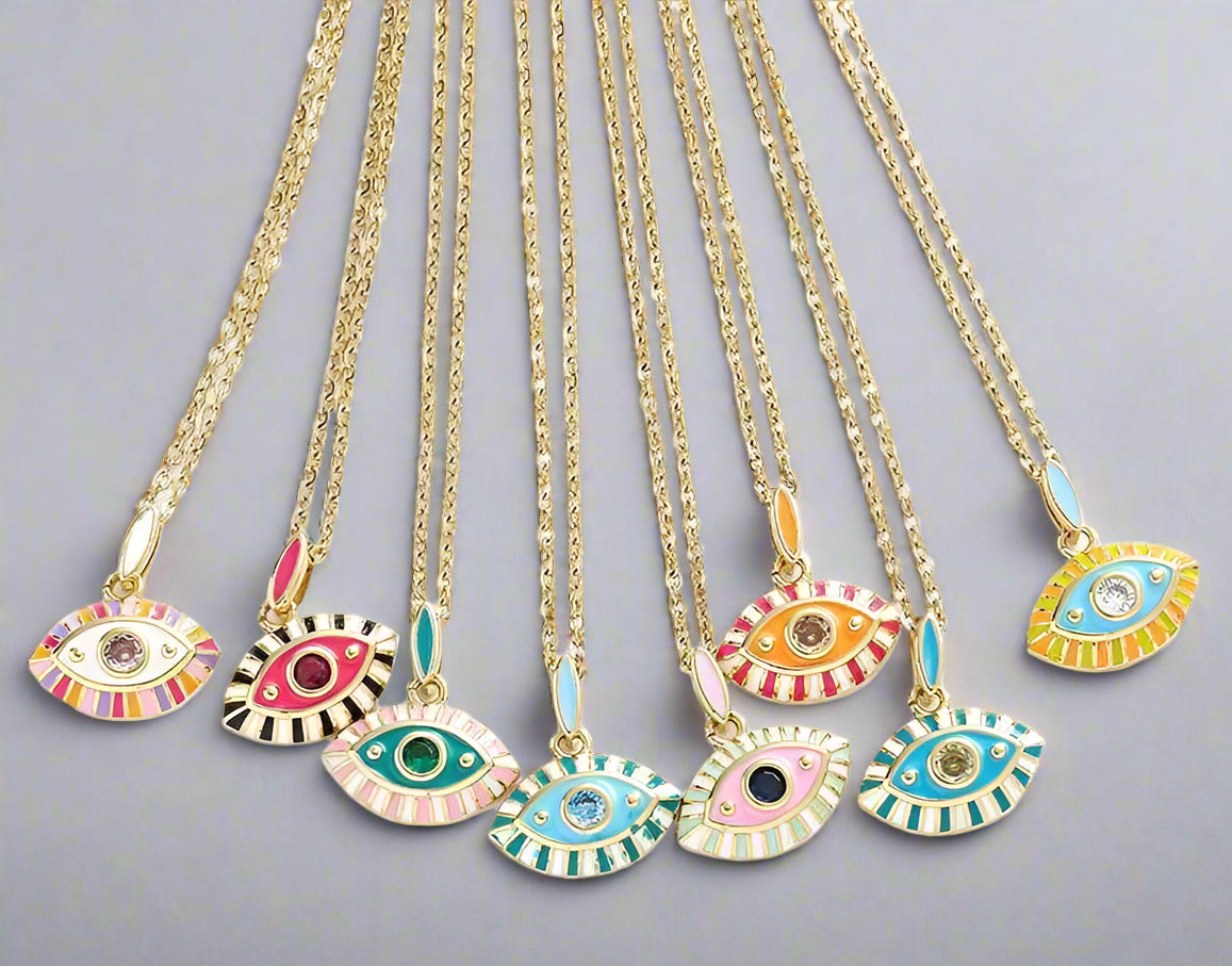 Set of colorful evil eye necklaces on gold chains against a white background