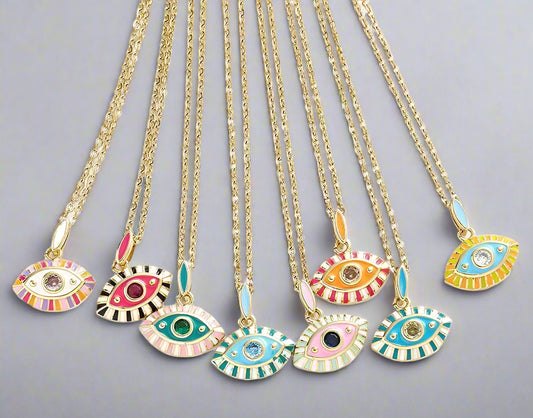 Set of colorful evil eye necklaces on gold chains against a white background