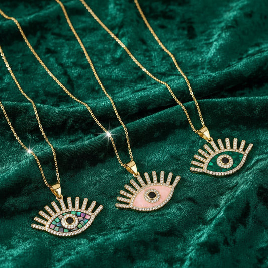 Three necklaces with eye-shaped pendants.